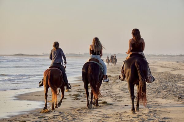 Horseback riding on the beach.