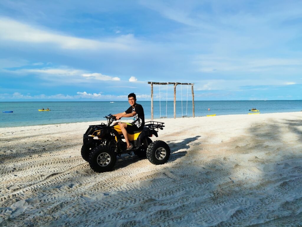 Riding atv motorcycle at the beach